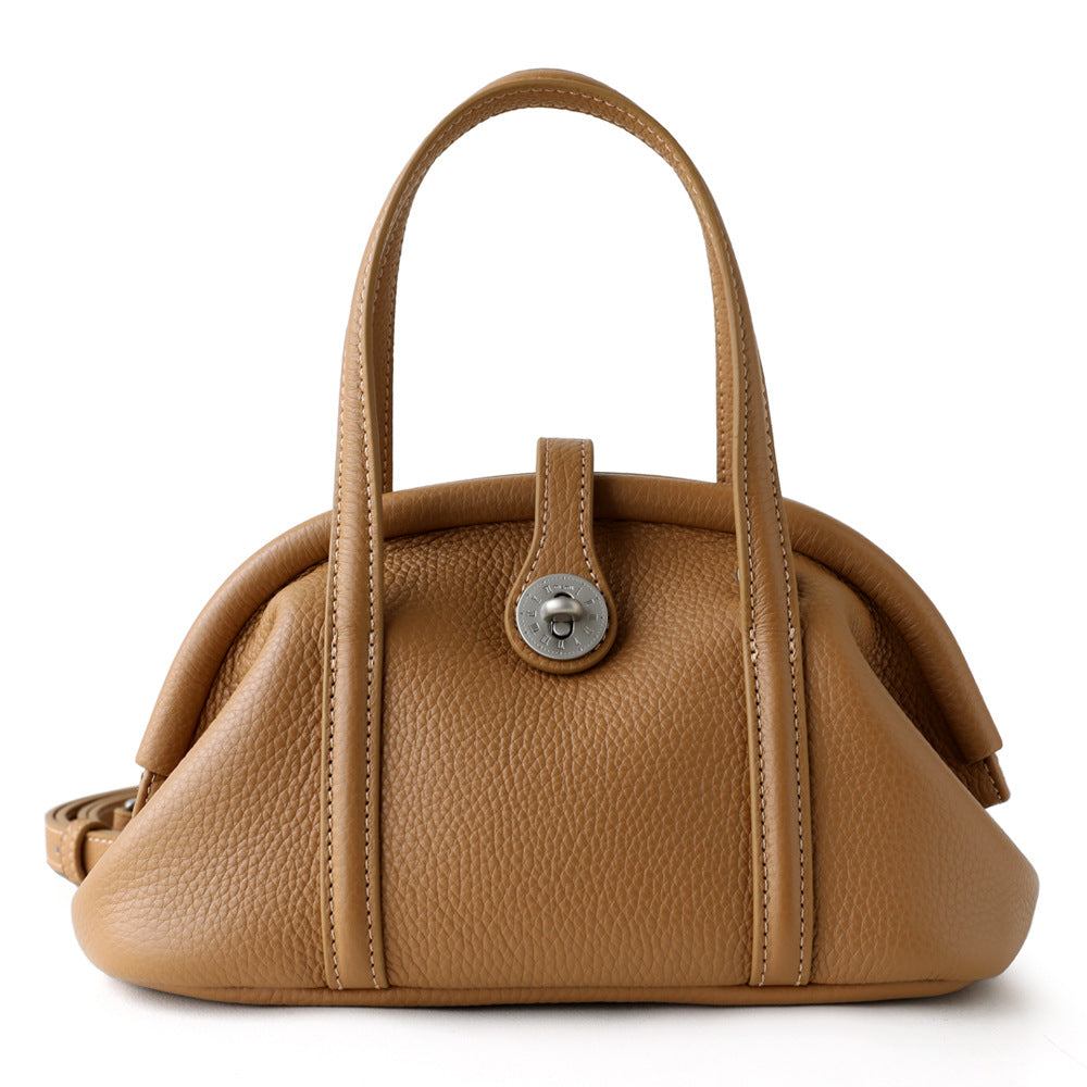 Biscuit tan pebbled leather top-handle bag with turn-lock