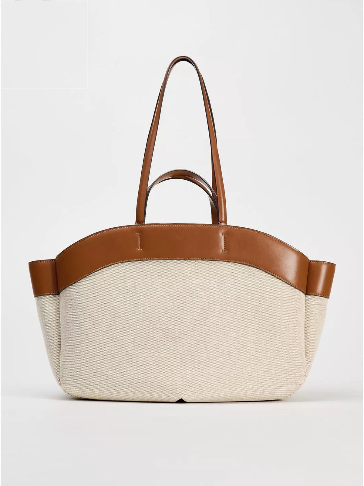 Beige canvas-look tote with tan trim and handles
