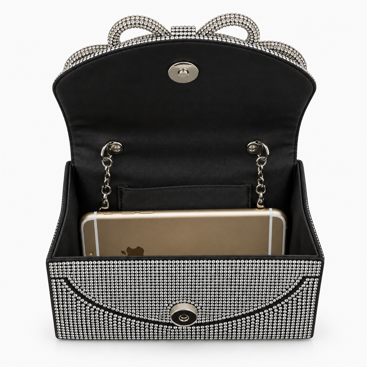 Open black evening bag showing satin lining, chain strap and a phone
