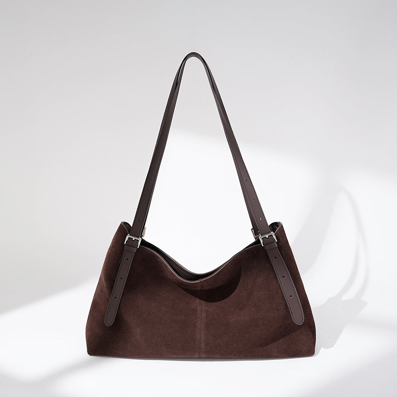 Brown faux suede tote, front view in soft light