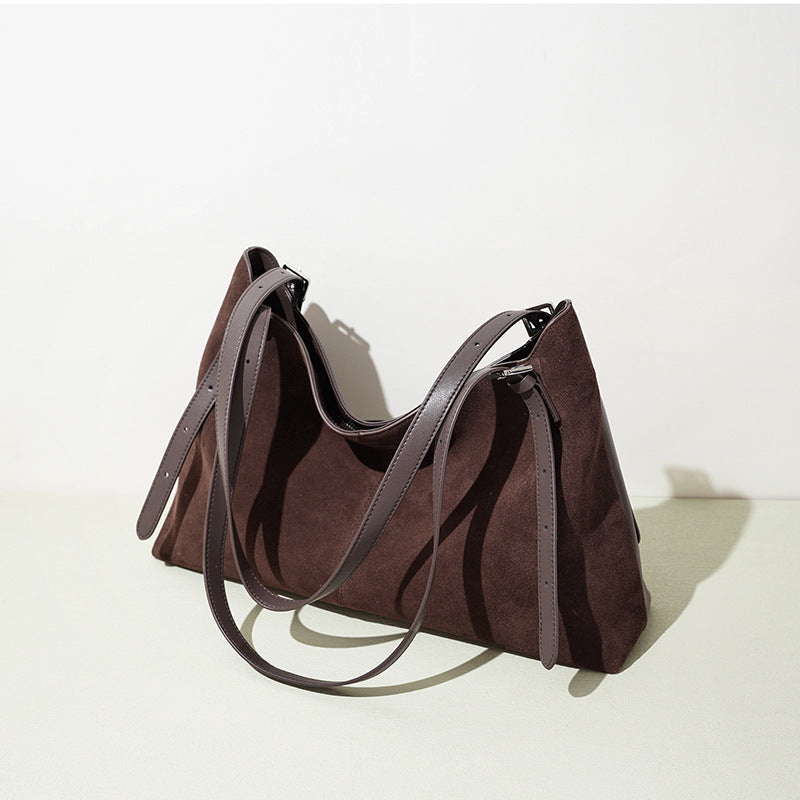 Brown faux suede tote with long straps, angled view